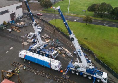 Cranes hoisting maintenance equipment for BART