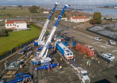 Cranes hoisting maintenance equipment for BART