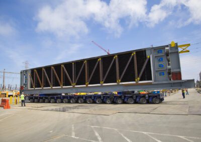 Cranes work at a power plant in Huntington Beach, California