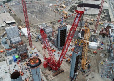 Cranes work at a power plant in Huntington Beach, California